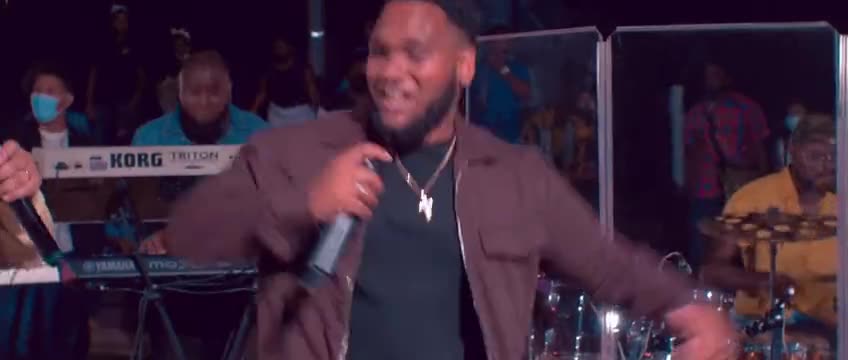 A singer performing with a live band