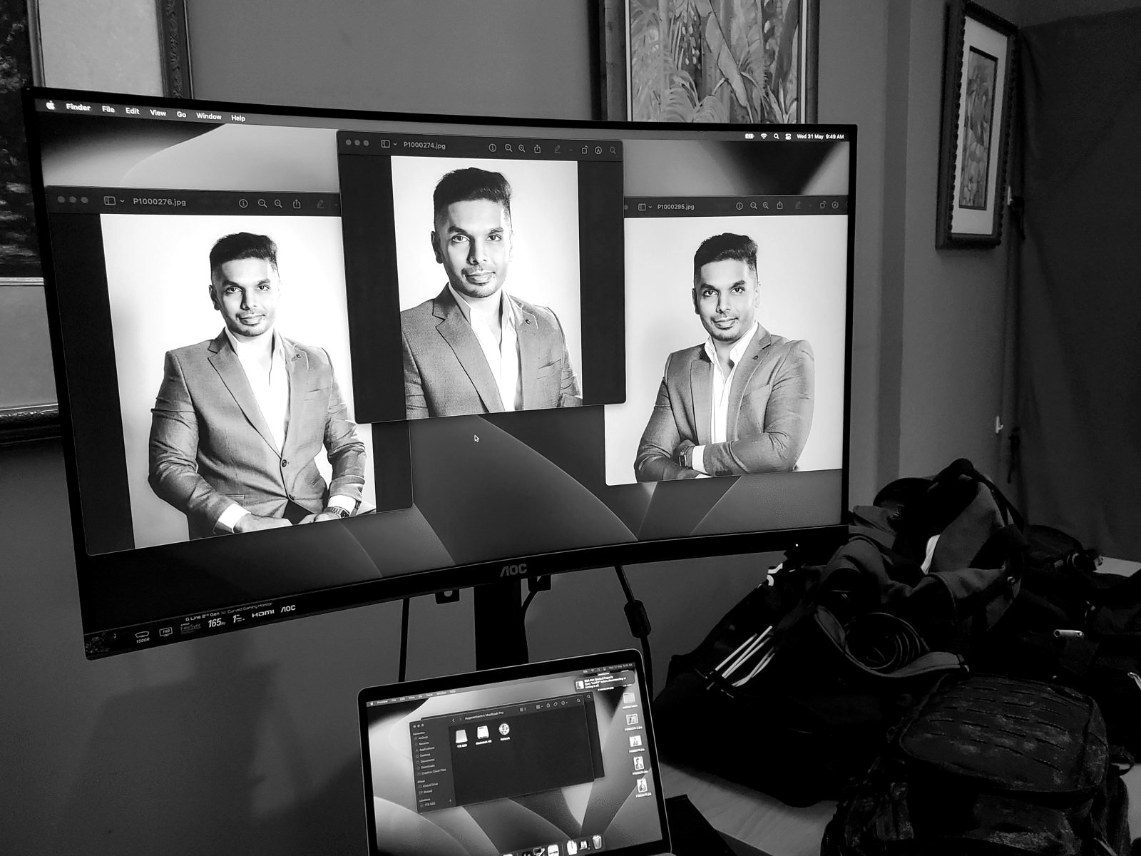 Reviewing a set of corporate portraits on the studio monitor